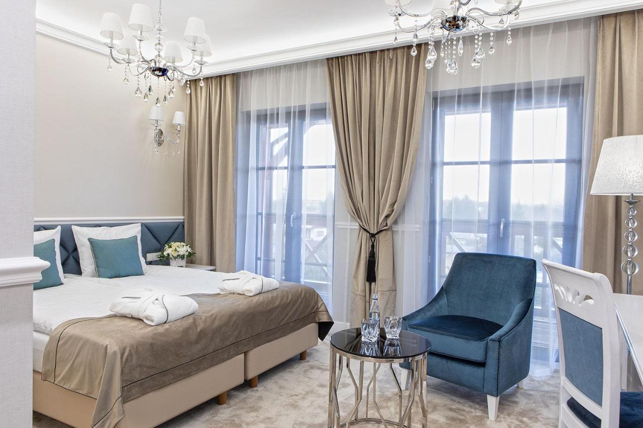 Boutique Odyseja & Spa チェホチネク エクステリア 写真 A bedroom in the hotel